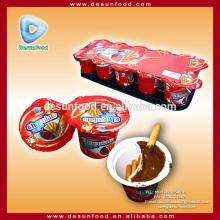 Chocolate cream cup with biscuit stick