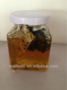 honeycomb honey in glass bottles