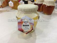 100%pure natural bee honey for beauty and healthy packed in glass honey bottle