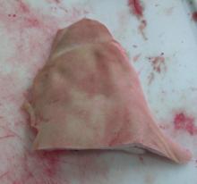 Frozen pork jowls rind on