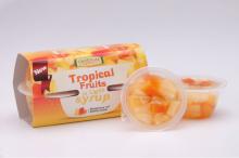 Tropical fruit salad in plastic cup