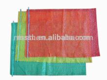 Red and green fruit netting bags for packing vegetable