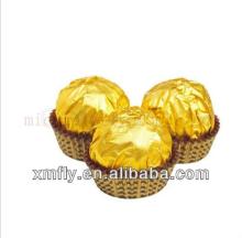 Golden paper wrapped round shape milk compound chocolate