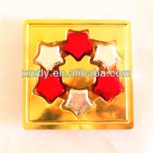Golden paper wrapped star shapes milka oat chocolate