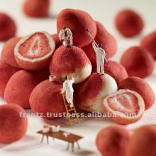 White chocolate truffles containing freeze-dried strawberries, coated with strawberry powder