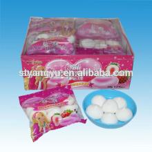 Beautiful girl packaging strawberry marshmallow candy