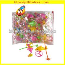 Best selling plastic dolphin drag flying spinning toys candy for kids