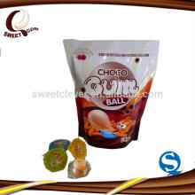 four different colors ang flavors gum ball with chocolate jam cup