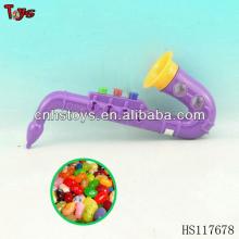saxophone  girl s toy candy