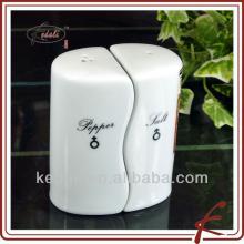 black and white ceramic pepper and spice rack