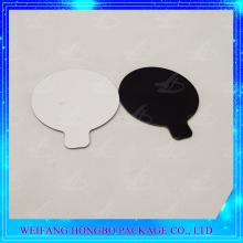 black cardboard cake pad